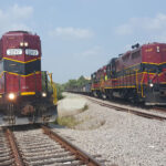 2 locomotives on railroad tracks